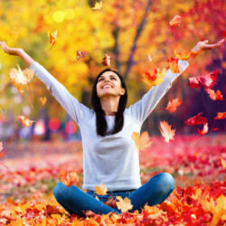 Happy Woman Enjoying Life in the Autumn on the Nature